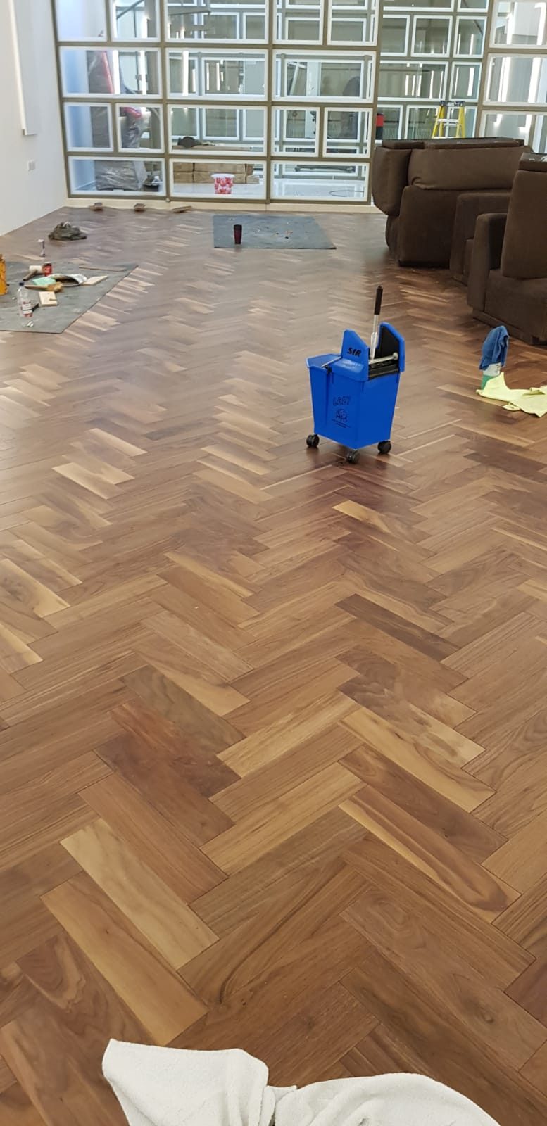 Parquet blocks laid out across a room, Thomas Joinery Services, Bedford