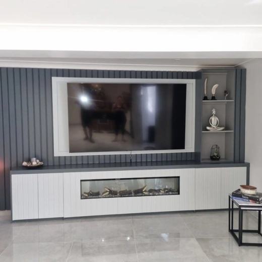 Bespoke TV media wall with built-in fire, made and fitted by Thomas Joinery Services