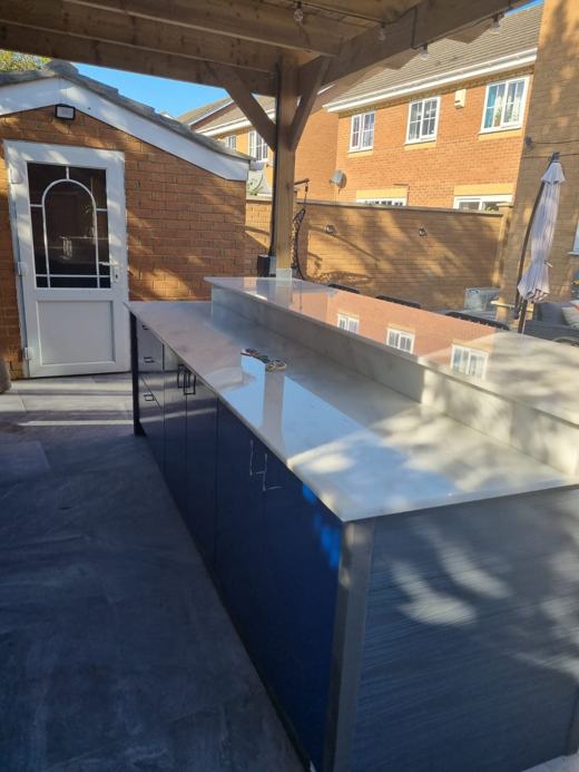 Timber pergola with outdoor kitchen built by Thomas Joinery Services